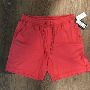 RHONE 7” Pursuit Athletic Unlined Brick Red Shorts